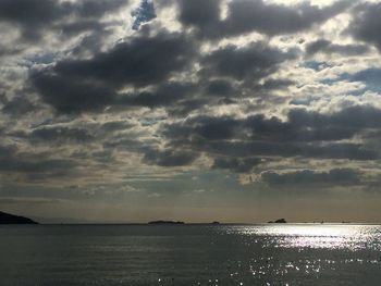 Scenic view of sea against cloudy sky