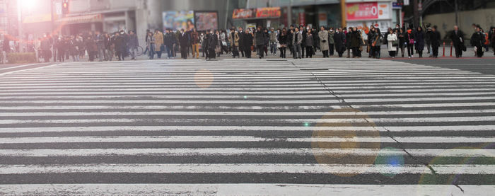 Group of people crossing road