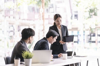 Colleagues working at office