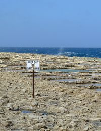 View of beach against blue sky