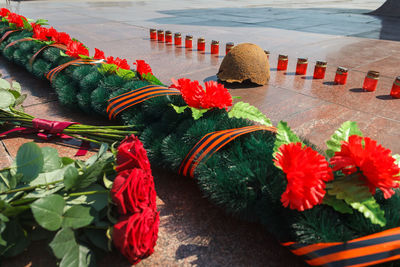 
laying flowers in memory of the fallen soldiers