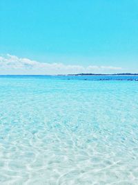 Scenic view of sea against blue sky