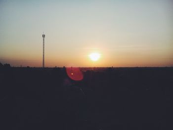 Silhouette landscape against sky during sunset