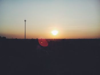 Silhouette landscape against sky during sunset