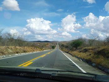 Road seen through car windshield