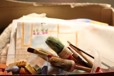 Close-up of paintbrushes on table