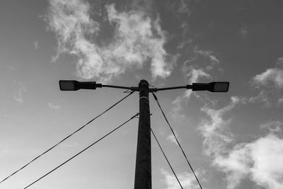 Low angle view of street light against sky