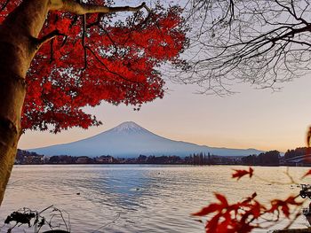 Scenic view of lake against sky during sunset