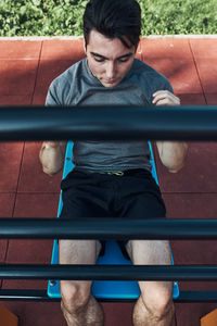 Young man exercising at park