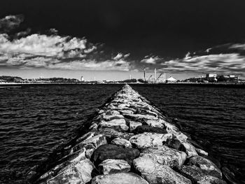 Scenic view of sea against cloudy sky