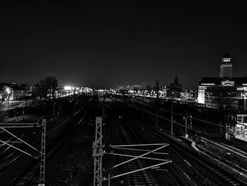 High angle view of railroad tracks against sky at night