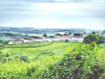 View of town against cloudy sky