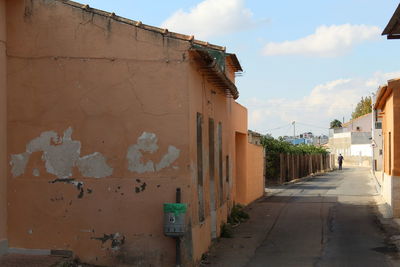 Alley amidst old buildings in town