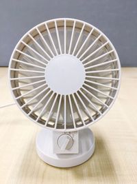 Close-up of electric fan on table