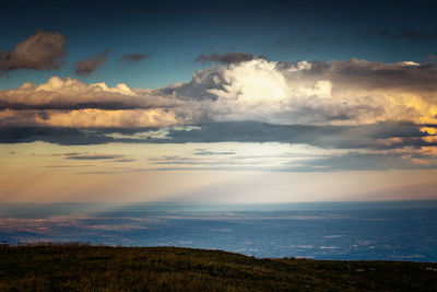 Scenic view of dramatic sky over land