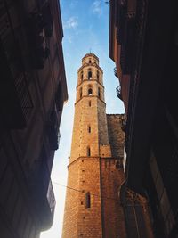 Low angle view of buildings against sky in city