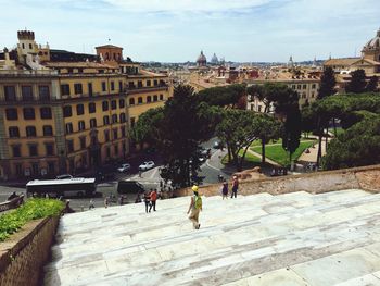 High angle view of people walking in city