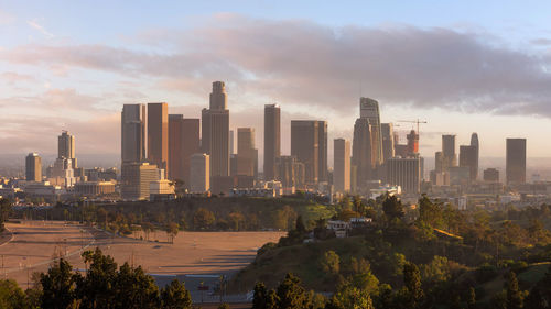 Modern city skyline at sunset