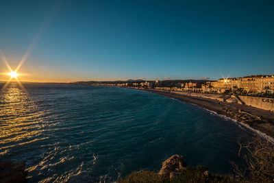 Scenic view of sea against clear sky during sunset