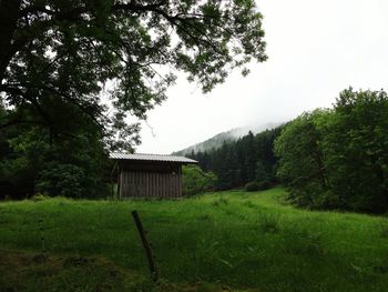 Built structure on field against sky