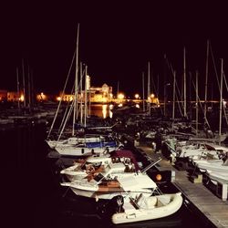 Boats moored at harbor