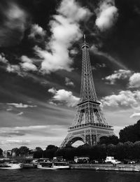 Low angle view of tower against cloudy sky