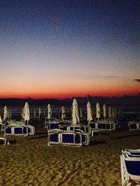 Empty bench at sunset