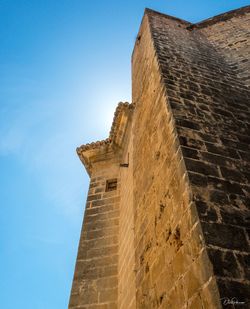 Low angle view of building against blue sky