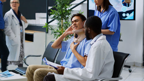 Female doctor examining patient in hospital