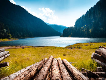 Scenic view of lake and mountains against sky