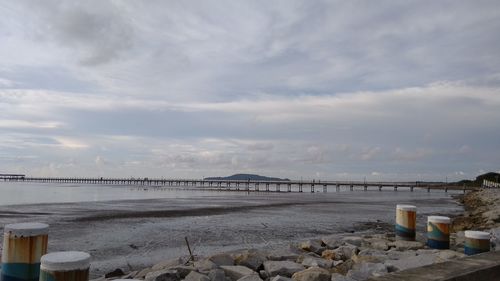 Bridge over sea against sky