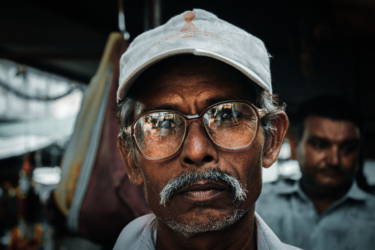 real people, portrait, glasses, headshot, front view, looking at camera, eyeglasses, focus on foreground, close-up, one person, men, mature adult, males, mature men, adult, lifestyles, beard, facial hair, clothing