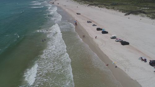 High angle view of people at sea shore