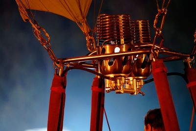 Low angle view of lighting equipment against sky