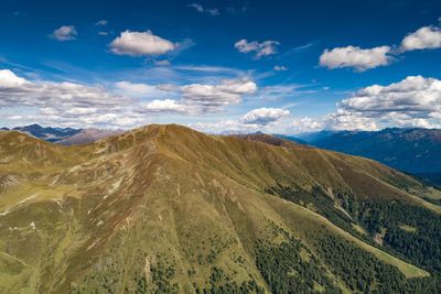 Scenic view of mountains against cloudy sky