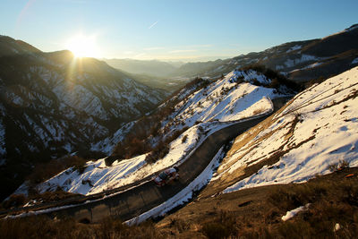 Scenic view of snowcapped mountains against sky