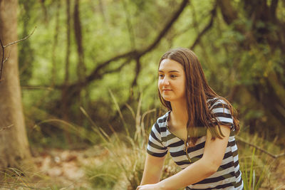 Young woman in forest