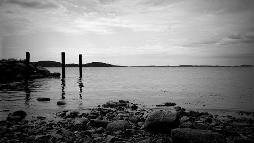 Scenic view of sea against cloudy sky