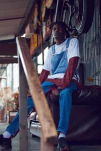 Low section of man sitting on chair