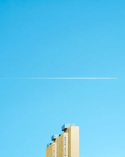 Low angle view of building against blue sky