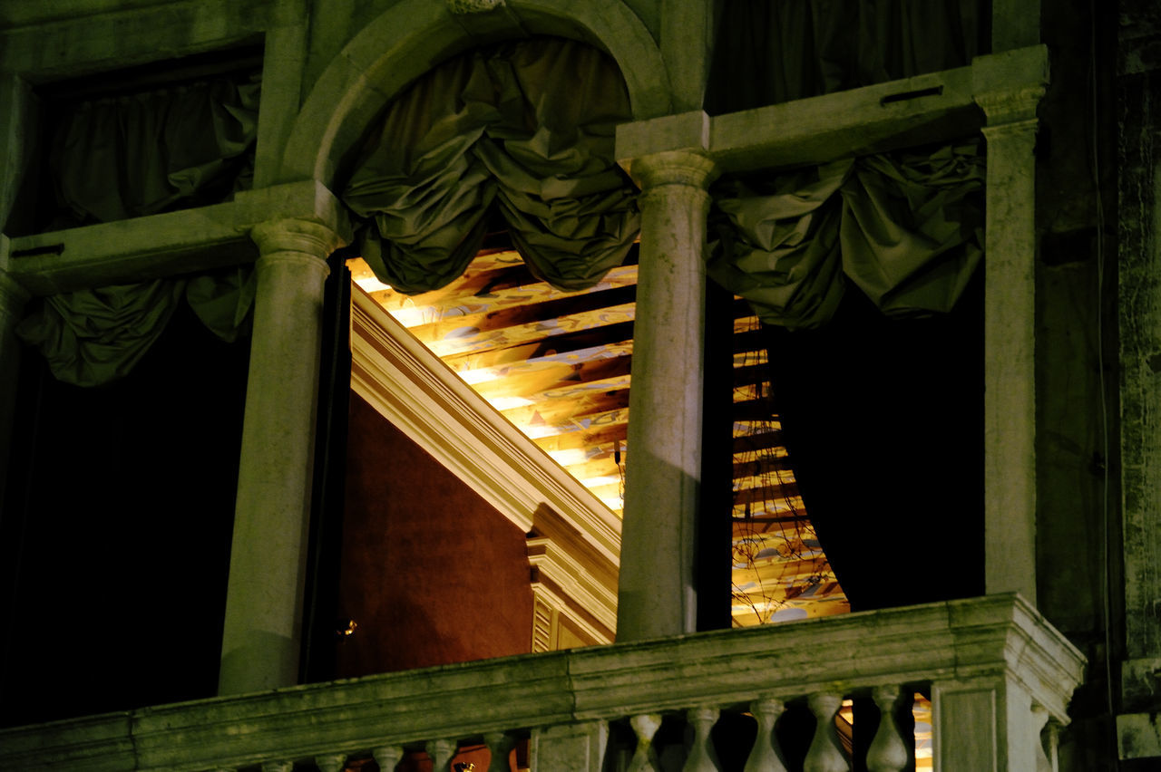 LOW ANGLE VIEW OF BUILDING SEEN THROUGH WINDOW