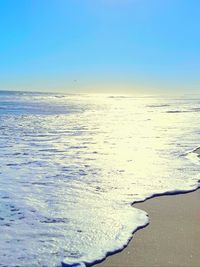 Scenic view of sea against clear blue sky