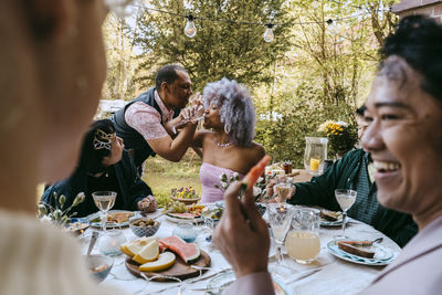 Cheerful friends of lgbtq community enjoying during party in back yard