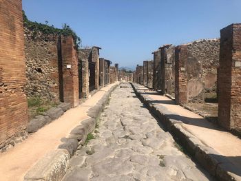 Empty alley along buildings pompeii