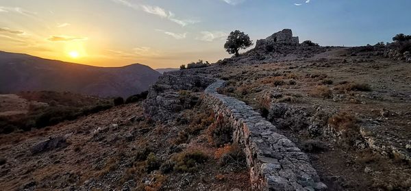 Scenic view of mountains against sky during sunset