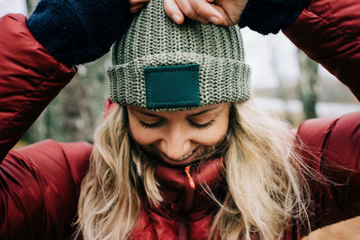 Portrait of young woman wearing hat