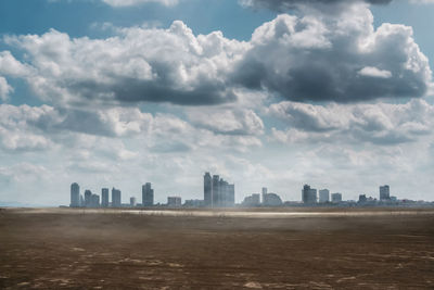 Buildings in city against sky