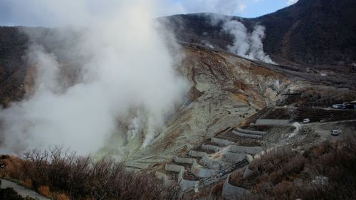 High angle view of smoke emitting from mountain