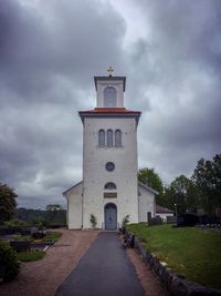 Tower amidst buildings against sky