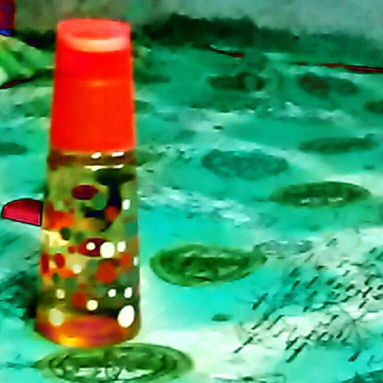 red, indoors, close-up, blue, still life, multi colored, water, bottle, plastic, paint, no people, creativity, art and craft, reflection, glass - material, focus on foreground, colorful, metal, green color, table